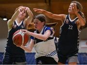 20 January 2022; Catherine McCreanor of OLSPCK in action against Katie Foley, left, and Alex Fegan of Colaiste Muire Crosshaven during the Pinergy Basketball Ireland U16 B Girls Schools Cup Final match between OLSPCK, Belfast, and Colaiste Muire Crosshaven, Cork, at the National Basketball Arena in Dublin. Photo by Harry Murphy/Sportsfile