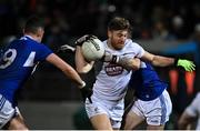 19 January 2022; Kevin O’Callaghan of Kildare in action against James Finn, left, and Trevor Collins of Laois during the O'Byrne Cup Semi-Final match between Laois and Kildare at Netwatch Cullen Park in Carlow. Photo by Seb Daly/Sportsfile