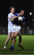 19 January 2022; Gareth Dillon of Laois in action against Paul Cribbin of Kildare during the O'Byrne Cup Semi-Final match between Laois and Kildare at Netwatch Cullen Park in Carlow. Photo by Seb Daly/Sportsfile