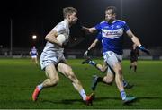 19 January 2022; Daniel Flynn of Kildare in action against Kieran Lillis of Laois during the O'Byrne Cup Semi-Final match between Laois and Kildare at Netwatch Cullen Park in Carlow. Photo by Seb Daly/Sportsfile