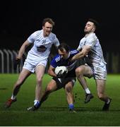 19 January 2022; Gareth Dillon of Laois in action against Paul Cribbin, left, and Kevin Flynn of Kildare during the O'Byrne Cup Semi-Final match between Laois and Kildare at Netwatch Cullen Park in Carlow. Photo by Seb Daly/Sportsfile