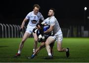 19 January 2022; Gareth Dillon of Laois in action against Paul Cribbin, left, and Kevin Flynn of Kildare during the O'Byrne Cup Semi-Final match between Laois and Kildare at Netwatch Cullen Park in Carlow. Photo by Seb Daly/Sportsfile