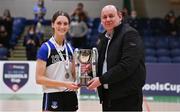 20 January 2022; OLSPCK captain Maebh Napier is presented the trophy by Basketball Ireland president PJ Reidy after the Pinergy Basketball Ireland U16 B Girls Schools Cup Final match between OLSPCK, Belfast, and Colaiste Muire Crosshaven, Cork, at the National Basketball Arena in Dublin. Photo by Harry Murphy/Sportsfile