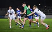 19 January 2022; Laois goalkeeper Matthew Byron in action against Daniel Flynn of Kildare during the O'Byrne Cup Semi-Final match between Laois and Kildare at Netwatch Cullen Park in Carlow. Photo by Seb Daly/Sportsfile