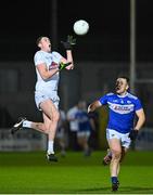 19 January 2022; Tadgh Hoey of Kildare in action against John O’Loughlin of Laois during the O'Byrne Cup Semi-Final match between Laois and Kildare at Netwatch Cullen Park in Carlow. Photo by Seb Daly/Sportsfile