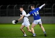 19 January 2022; Tom Harrington of Kildare in action against Evan O’Carroll of Laois during the O'Byrne Cup Semi-Final match between Laois and Kildare at Netwatch Cullen Park in Carlow. Photo by Seb Daly/Sportsfile