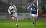 19 January 2022; Kevin Flynn of Kildare in action against Ross Munnelly of Laois during the O'Byrne Cup Semi-Final match between Laois and Kildare at Netwatch Cullen Park in Carlow. Photo by Seb Daly/Sportsfile