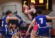 19 January 2022; Liam Price of St Munchin's College in action against Maitiú Heckmann, left, and Patrick Morris of Blackrock College during the Pinergy Basketball Ireland U19 B Boys Schools Cup Final match between Blackrock College, Dublin, and St Munchin’s College, Limerick, at the National Basketball Arena in Dublin. Photo by Piaras Ó Mídheach/Sportsfile