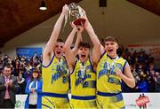 21 January 2022; UCD Marian co-captains, from left, Luke Gilleran, Brian O'Hara Duggan and Paraic Moran celebrate with the cup after during the InsureMyHouse.ie U20 Men's National Cup Final match between UCC Blue Demons, Cork and UCD Marian, Dublin at the National Basketball Arena in Tallaght, Dublin. Photo by Brendan Moran/Sportsfile