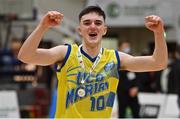 21 January 2022; Ronan Byrne of UCD Marian celebrates with his medal after the InsureMyHouse.ie U20 Men's National Cup Final match between UCC Blue Demons, Cork and UCD Marian, Dublin at the National Basketball Arena in Tallaght, Dublin. Photo by Brendan Moran/Sportsfile