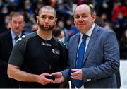 21 January 2022; President of Basketball Ireland PJ Reidy presents referee Mariusz Landos with his medal after the InsureMyHouse.ie U20 Men's National Cup Final match between UCC Blue Demons, Cork and UCD Marian, Dublin at the National Basketball Arena in Tallaght, Dublin. Photo by Brendan Moran/Sportsfile