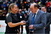 21 January 2022; President of Basketball Ireland PJ Reidy presents referee Caitriona White with her medal after the InsureMyHouse.ie U20 Men's National Cup Final match between UCC Blue Demons, Cork and UCD Marian, Dublin at the National Basketball Arena in Tallaght, Dublin. Photo by Brendan Moran/Sportsfile