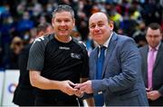 21 January 2022; President of Basketball Ireland PJ Reidy presents referee Joe Lavin with his medal after the InsureMyHouse.ie U20 Men's National Cup Final match between UCC Blue Demons, Cork and UCD Marian, Dublin at the National Basketball Arena in Tallaght, Dublin. Photo by Brendan Moran/Sportsfile