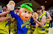 21 January 2022; UCD Marian players celebrate with their mascot after the InsureMyHouse.ie U20 Men's National Cup Final match between UCC Blue Demons, Cork and UCD Marian, Dublin at the National Basketball Arena in Tallaght, Dublin. Photo by Brendan Moran/Sportsfile