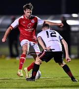 21 January 2022; Billy King of St Patrick's Athletic in action against Max Murphy of Bohemians during the pre-season friendly match between Bohemians and St Patrick's Athletic at the FAI National Training Centre in Abbotstown, Dublin. Photo by Piaras Ó Mídheach/Sportsfile