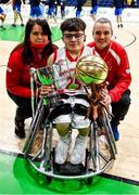 22 January 2022; Conor Coughlan of Rebel Wheelers celebrates with his parents Mary and Con and the cup and MVP award after the InsureMyHouse.ie IWA Cup final match between Killester BC, Dublin, and Rebel Wheelers, Cork, at National Basketball Arena in Tallaght, Dublin. Photo by Brendan Moran/Sportsfile