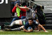 22 January 2022; Hugo Keenan of Leinster scores his side's eighth try despite the tackle of Charlie Ewels of Bath during the Heineken Champions Cup Pool A match between Bath and Leinster at The Recreation Ground in Bath, England. Photo by Harry Murphy/Sportsfile