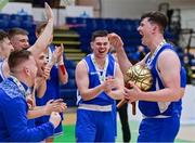 22 January 2022; David Lehane of UCC Demons celebrates with his teammates on being named MVP after  the InsureMyHouse.ie Presidents' National Cup Final match between UCC Demons, Cork, and Drogheda Wolves, Louth, at National Basketball Arena in Tallaght, Dublin. Photo by Brendan Moran/Sportsfile