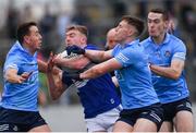 22 January 2022; Seán O’Flynn of Laois in action against Dublin players, left to right, Cormac Costello, John Small, and Brian Fenton during the O'Byrne Cup Final match between Dublin and Laois at Netwatch Cullen Park in Carlow. Photo by Daire Brennan/Sportsfile