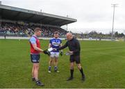 22 January 2022; Referee Cormac Reilly hands Dublin captain Ciarán Kilkenny the Laois team-sheet ahead of the O'Byrne Cup Final match between Dublin and Laois at Netwatch Cullen Park in Carlow. Photo by Daire Brennan/Sportsfile