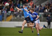 22 January 2022; Lee Gannon of Dublin in action against Seán Moore of Laois during the O'Byrne Cup Final match between Dublin and Laois at Netwatch Cullen Park in Carlow. Photo by Daire Brennan/Sportsfile