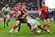 22 January 2022; Michael Lowry of Ulster is tackled by Jacobus Van Tonder, left, and Cheik Tiberghien of ASM Clermont Auvergne during the Heineken Champions Cup Pool A match between Ulster and Clermont Auvergne at Kingspan Stadium in Belfast. Photo by Ramsey Cardy/Sportsfile