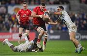 22 January 2022; Nick Timoney of Ulster is tackled by Judicaël Cancoriet, left, and Jean-Pascal Barraque of ASM Clermont Auvergne during the Heineken Champions Cup Pool A match between Ulster and Clermont Auvergne at Kingspan Stadium in Belfast. Photo by Ramsey Cardy/Sportsfile