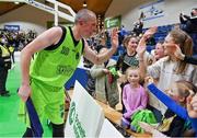22 January 2022; Kieran Donaghy of Garvey's Tralee Warriors celebrates with young fans after the InsureMyHouse.ie Pat Duffy Men’s National Cup Final match between C&S Neptune, Cork, and Garvey's Warriors Tralee, Kerry, at National Basketball Arena in Tallaght, Dublin. Photo by Brendan Moran/Sportsfile