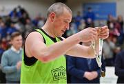 22 January 2022; Kieran Donaghy of Garvey's Tralee Warriors admires his winner's medal after the InsureMyHouse.ie Pat Duffy Men’s National Cup Final match between C&S Neptune, Cork, and Garvey's Warriors Tralee, Kerry, at National Basketball Arena in Tallaght, Dublin. Photo by Brendan Moran/Sportsfile