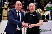 22 January 2022; President of Basketball Ireland PJ Reidy presents referee Martin McGettrick with his medal after the InsureMyHouse.ie Presidents' National Cup Final match between UCC Demons, Cork, and Drogheda Wolves, Louth, at National Basketball Arena in Tallaght, Dublin. Photo by Brendan Moran/Sportsfile