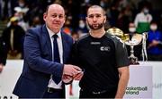 22 January 2022; President of Basketball Ireland PJ Reidy presents referee Mariusz Landos with his medal after the InsureMyHouse.ie Presidents' National Cup Final match between UCC Demons, Cork, and Drogheda Wolves, Louth, at National Basketball Arena in Tallaght, Dublin. Photo by Brendan Moran/Sportsfile
