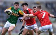 22 January 2022; Tony Brosnan of Kerry in action against Cork players Tadhg Corkery and Matthew Taylor, 4, during the McGrath Cup Final match between Kerry and Cork at Fitzgerald Stadium in Killarney, Kerry. Photo by Piaras Ó Mídheach/Sportsfile