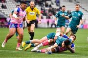 23 January 2022; Alex Wootton of Connacht scores his side's first try, despite the tackle of Stade Francais Paris' Ngani Laumape, during the Heineken Champions Cup Pool A match between Stade Francais Paris and Connacht at Stade Jean Bouin in Paris, France. Photo by Seb Daly/Sportsfile