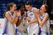 23 January 2022; Sarah Hickey of Waterford Wildcats celebrates with teammates, from left, Grace O'Brien, Bami Olukovode and Ciara Butler after being named MVP after the InsureMyHouse.ie U20 Women's National Cup Final match between Portlaoise Panthers, Laois, and Waterford Wildcats, Waterford, at National Basketball Arena in Tallaght, Dublin. Photo by Brendan Moran/Sportsfile