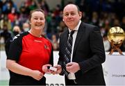 23 January 2022; Referee Tara Dunphy is presented with their medal by Basketball Ireland president PJ reidy after the InsureMyHouse.ie U20 Women's National Cup Final match between Portlaoise Panthers, Laois, and Waterford Wildcats, Waterford, at National Basketball Arena in Tallaght, Dublin. Photo by Brendan Moran/Sportsfile