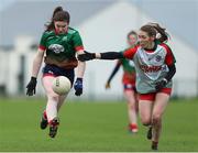 23 January 2022; Emma Cody of Mullinahone in action against Ellen Muldoon of St Brendan's during the 2021 currentaccount.ie All-Ireland Ladies Junior Club Football Championship Semi-Final match between Mullinahone, Tipperary and St Brendan's, Galway at John Lockes GAA Club in Callan, Kilkenny. Photo by Michael P Ryan/Sportsfile