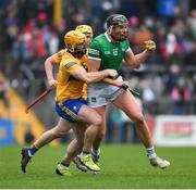 23 January 2022; Gearoid Hegarty of Limerick is tackled by Jason McCarthy of Clare during the 2022 Co-op Superstores Munster Hurling Cup Final match between Limerick and Clare at Cusack Park in Ennis, Clare. Photo by Ray McManus/Sportsfile