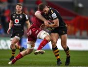 23 January 2022; Josh Bassett of Wasps is tackled by Jack O'Donoghue of Munster during the Heineken Champions Cup Pool B match between Munster and Wasps at Thomond Park in Limerick. Photo by Sam Barnes/Sportsfile