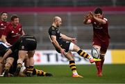 23 January 2022; Dan Robson of Wasps kicks under pressure from Jean Kleyn of Munster during the Heineken Champions Cup Pool B match between Munster and Wasps at Thomond Park in Limerick. Photo by Piaras Ó Mídheach/Sportsfile