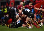 23 January 2022; Ben Healy of Munster is tackled by Munster players Elliott Stooke, 4, and Tom Cruse during the Heineken Champions Cup Pool B match between Munster and Wasps at Thomond Park in Limerick. Photo by Piaras Ó Mídheach/Sportsfile
