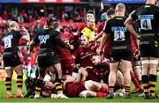 23 January 2022; Jeremy Loughman of Munster, centre, is helped to his feet by teammates after scoring his side's fourth try during the Heineken Champions Cup Pool B match between Munster and Wasps at Thomond Park in Limerick. Photo by Sam Barnes/Sportsfile