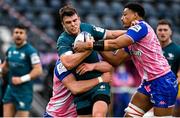 23 January 2022; Tom Farrell of Connacht is tackled by Paul Gabrillagues, left, and Charlie Francoz of Stade Francais Paris during the Heineken Champions Cup Pool A match between Stade Francais Paris and Connacht at Stade Jean Bouin in Paris, France. Photo by Seb Daly/Sportsfile