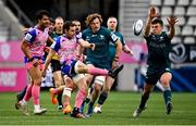 23 January 2022; Nicolas Sanchez of Stade Francais Paris kicks down field under pressure from Tom Farrell of Connacht during the Heineken Champions Cup Pool A match between Stade Francais Paris and Connacht at Stade Jean Bouin in Paris, France. Photo by Seb Daly/Sportsfile