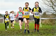 22 January 2022; Coco Smith of North Down AC, 825, and Emilee White of King's Park Primary School during the World Athletics Northern Ireland International Cross Country at Billy Neill MBE Country Park in Belfast. Photo by Ramsey Cardy/Sportsfile