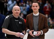 23 January 2022; Referee Martin McGettrick is presented with his medal by James Cullen of InsureMyHouse.ie after  the InsureMyHouse.ie Paudie O'Connor National Cup Final match between The Address UCC Glanmire, Cork, and DCU Mercy, Dublin, at National Basketball Arena in Tallaght, Dublin. Photo by Brendan Moran/Sportsfile