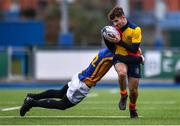 25 January 2022; Josh Hansen of St Fintans High School is tackled by Jack Sweeney of Wilsons Hospital during the Bank of Ireland Vinnie Murray Cup 1st Round match between St Fintans High School, Dublin and Wilsons Hospital, Westmeath at Energia Park in Dublin. Photo by Ben McShane/Sportsfile