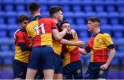 25 January 2022; Matthew Linehan of St Fintans High School, centre, celebrates with his teammates after scoring his side's first try during the Bank of Ireland Vinnie Murray Cup 1st Round match between St Fintans High School, Dublin and Wilsons Hospital, Westmeath at Energia Park in Dublin. Photo by Ben McShane/Sportsfile