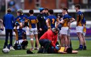 25 January 2022; Conor Cribbin of St Fintans High School receives medical attention during the Bank of Ireland Vinnie Murray Cup 1st Round match between St Fintans High School, Dublin and Wilsons Hospital, Westmeath at Energia Park in Dublin. Photo by Ben McShane/Sportsfile