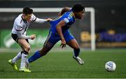 25 January 2022; Promise Omochere of Bohemians in action against Darragh Leahy of Dundalk during the pre-season friendly match between Dundalk and Bohemians at Oriel Park in Dundalk, Louth. Photo by Ramsey Cardy/Sportsfile