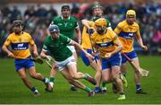 23 January 2022; Jason McCarthy of Clare in action against David Reidy of Limerick during the 2022 Co-op Superstores Munster Hurling Cup Final match between Limerick and Clare at Cusack Park in Ennis, Clare. Photo by Ray McManus/Sportsfile